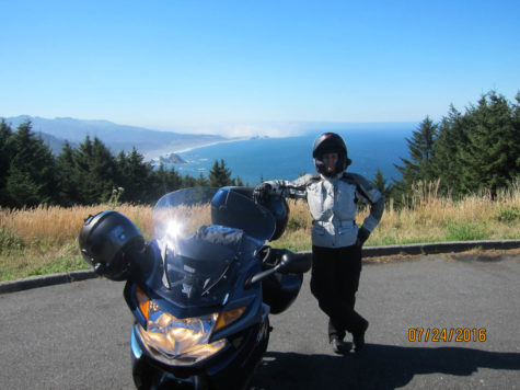 motorcycle and woman on road